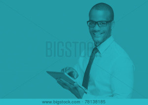 Man smiling and using a tablet.