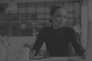 Woman working at desk in office.